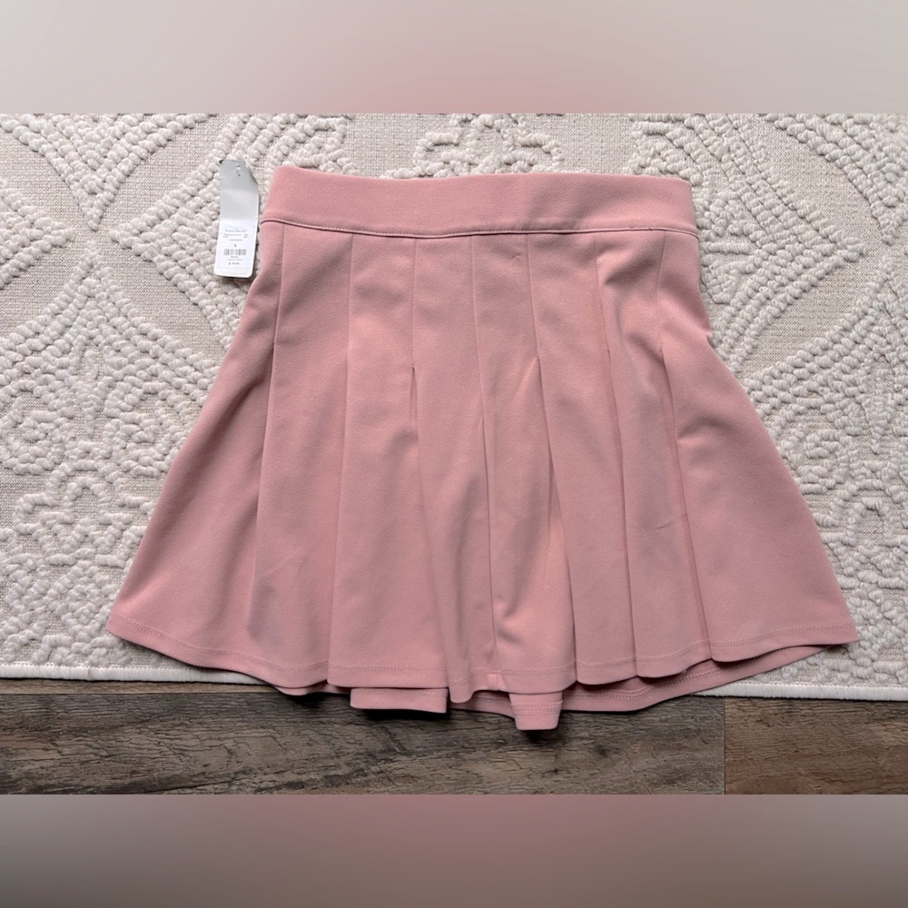 Pink pleated tennis skirt.